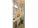 Half bath features a vessel sink, decorative mirror and chandelier lighting at 105 N Central Ave, Belmont, NC 28012