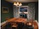 Dining room featuring hardwood floors, chandelier lighting, and custom draperies at 105 N Central Ave, Belmont, NC 28012