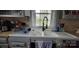 Kitchen featuring deep farmhouse style sink and tile countertops at 105 N Central Ave, Belmont, NC 28012