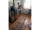Kitchen with hardwood floors, stainless appliances and light colored cabinets at 105 N Central Ave, Belmont, NC 28012