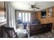 Bright Living Room featuring hardwood walls and ceiling fan at 105 N Central Ave, Belmont, NC 28012