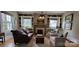 Inviting living room featuring a cozy fireplace, built-in bookshelves, and ample natural light at 105 N Central Ave, Belmont, NC 28012