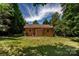 Spacious backyard with a lush lawn and mature trees offering plenty of shade at 110 Book Ct, Statesville, NC 28677
