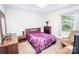 Cozy bedroom with a comfortable bed, dresser, rocking chair, and natural light at 110 Book Ct, Statesville, NC 28677