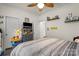 Comfortable bedroom with a ceiling fan and modern decor for a tranquil and personalized space at 113 Robinette Ln, Statesville, NC 28625