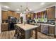 Modern kitchen with island, granite countertops, and stainless steel appliances, perfect for cooking and entertaining at 113 Robinette Ln, Statesville, NC 28625