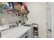 Efficient laundry room equipped with modern appliances and shelving for organized storage at 113 Robinette Ln, Statesville, NC 28625