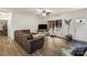 Bright living room featuring a comfortable sofa, stylish decor, and a large window offering natural light at 113 Robinette Ln, Statesville, NC 28625
