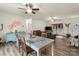 Open living space with dining, sitting areas and large windows, bathed in natural light with modern finishes at 113 Robinette Ln, Statesville, NC 28625
