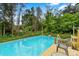 Refreshing above-ground pool surrounded by a deck, providing a private outdoor oasis at 113 Robinette Ln, Statesville, NC 28625