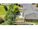 A house from a birds eye view shows off the backyard patio, shed, and privacy fence at 116 Maggie Dr, Mount Holly, NC 28120