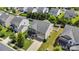 Charming home with a two-car garage, and a landscaped yard surrounded by lush trees in a Gathering-friendly neighborhood at 116 Maggie Dr, Mount Holly, NC 28120
