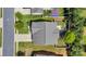 Birds eye view of home with a gray roof, well manicured lawn and backyard patio furniture at 116 Maggie Dr, Mount Holly, NC 28120