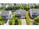 Aerial view of a beautiful house featuring a two-car garage, and a fenced backyard with a playground at 116 Maggie Dr, Mount Holly, NC 28120