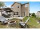 Outdoor living with a cozy fire pit and comfortable seating area at 116 Maggie Dr, Mount Holly, NC 28120