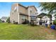 Spacious backyard with a pergola, dining area and grill for outdoor gatherings at 116 Maggie Dr, Mount Holly, NC 28120