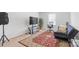 Cozy bedroom with TV, comfortable chair, plants, and a decorative area rug at 116 Maggie Dr, Mount Holly, NC 28120
