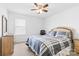 Bedroom with neutral carpet, a ceiling fan, and a window at 116 Maggie Dr, Mount Holly, NC 28120