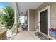 Cozy front porch with stone pillars and seating area at 116 Maggie Dr, Mount Holly, NC 28120