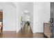 Bright entryway hallway with hardwood floors and white trim at 116 Maggie Dr, Mount Holly, NC 28120