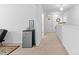 Hallway features a mini refrigerator, neutral walls, and access to other rooms at 116 Maggie Dr, Mount Holly, NC 28120