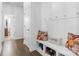 Hallway with a bench, storage space, coat hooks, and hardwood floors at 116 Maggie Dr, Mount Holly, NC 28120