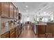 Spacious kitchen with dark wood cabinets and stainless steel appliances at 116 Maggie Dr, Mount Holly, NC 28120