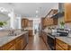 Long spacious kitchen with stainless steel appliances and plenty of counter space at 116 Maggie Dr, Mount Holly, NC 28120