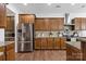 Modern kitchen with stainless steel refrigerator and ample cabinet space at 116 Maggie Dr, Mount Holly, NC 28120