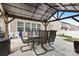 Covered patio perfect for outdoor dining and relaxation at 116 Maggie Dr, Mount Holly, NC 28120