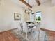 Cozy dining area featuring a round table, upholstered chairs, stylish lighting and natural light at 1172 Springlake Rd, York, SC 29745