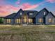 Inviting two-story home featuring stone accents, modern siding, large windows, and a beautifully landscaped front yard at 1172 Springlake Rd, York, SC 29745