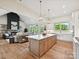 Stylish kitchen with center island, pendant lighting, and a view of the inviting living space at 1172 Springlake Rd, York, SC 29745
