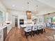 Gourmet kitchen with stainless appliances, pendant lighting, oversized island, and open floor plan to dining room at 1172 Springlake Rd, York, SC 29745