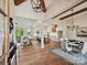 Open-concept living and dining area with hardwood floors, vaulted ceilings, modern lighting, and a bright, white kitchen at 1172 Springlake Rd, York, SC 29745