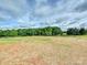 An empty lot sits ready for development, framed by a lush tree line, offering a blank canvas for a dream home at 1172 Springlake Rd, York, SC 29745