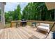 Inviting deck space with grill, outdoor seating, and natural wood finish for relaxation and entertainment at 13025 Cinnamon Fern Ln, Charlotte, NC 28227