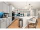 Kitchen featuring a large island with bar seating, stainless appliances, and modern cabinetry at 13025 Cinnamon Fern Ln, Charlotte, NC 28227