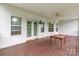 Spacious back porch with a ceiling fan, french doors, and multiple windows for lots of natural light at 132 Homeplace Ln, Statesville, NC 28625