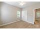 Bedroom featuring neutral carpet, a window, closet, and neutral paint at 132 Homeplace Ln, Statesville, NC 28625