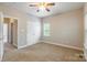 Cozy bedroom with neutral carpet, one window, and a double door closet at 132 Homeplace Ln, Statesville, NC 28625