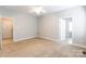 Large bedroom with carpet and view to bathroom and closet at 132 Homeplace Ln, Statesville, NC 28625