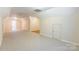 Bright carpeted bonus room with neutral walls and a combination of hardwood and carpet in the far corner at 132 Homeplace Ln, Statesville, NC 28625