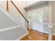 The front entrance showcases hardwood floors and a staircase leading to the upper level at 132 Homeplace Ln, Statesville, NC 28625