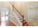 Bright foyer features hardwood floors, stairs, and a view into adjacent rooms at 132 Homeplace Ln, Statesville, NC 28625