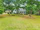 A scenic aerial view showcases the home nestled within a lush, tree-filled landscape at 132 Homeplace Ln, Statesville, NC 28625
