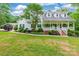 Charming two-story home featuring a welcoming front porch and beautifully landscaped front yard at 132 Homeplace Ln, Statesville, NC 28625