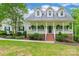 Inviting home exterior with a brick-lined front porch, perfect for relaxing outdoors at 132 Homeplace Ln, Statesville, NC 28625
