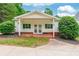 Charming front porch with brick accents and a welcoming entrance to the home at 132 Homeplace Ln, Statesville, NC 28625