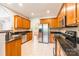 Spacious kitchen with stainless steel appliances, granite countertops, and oak cabinets at 132 Homeplace Ln, Statesville, NC 28625